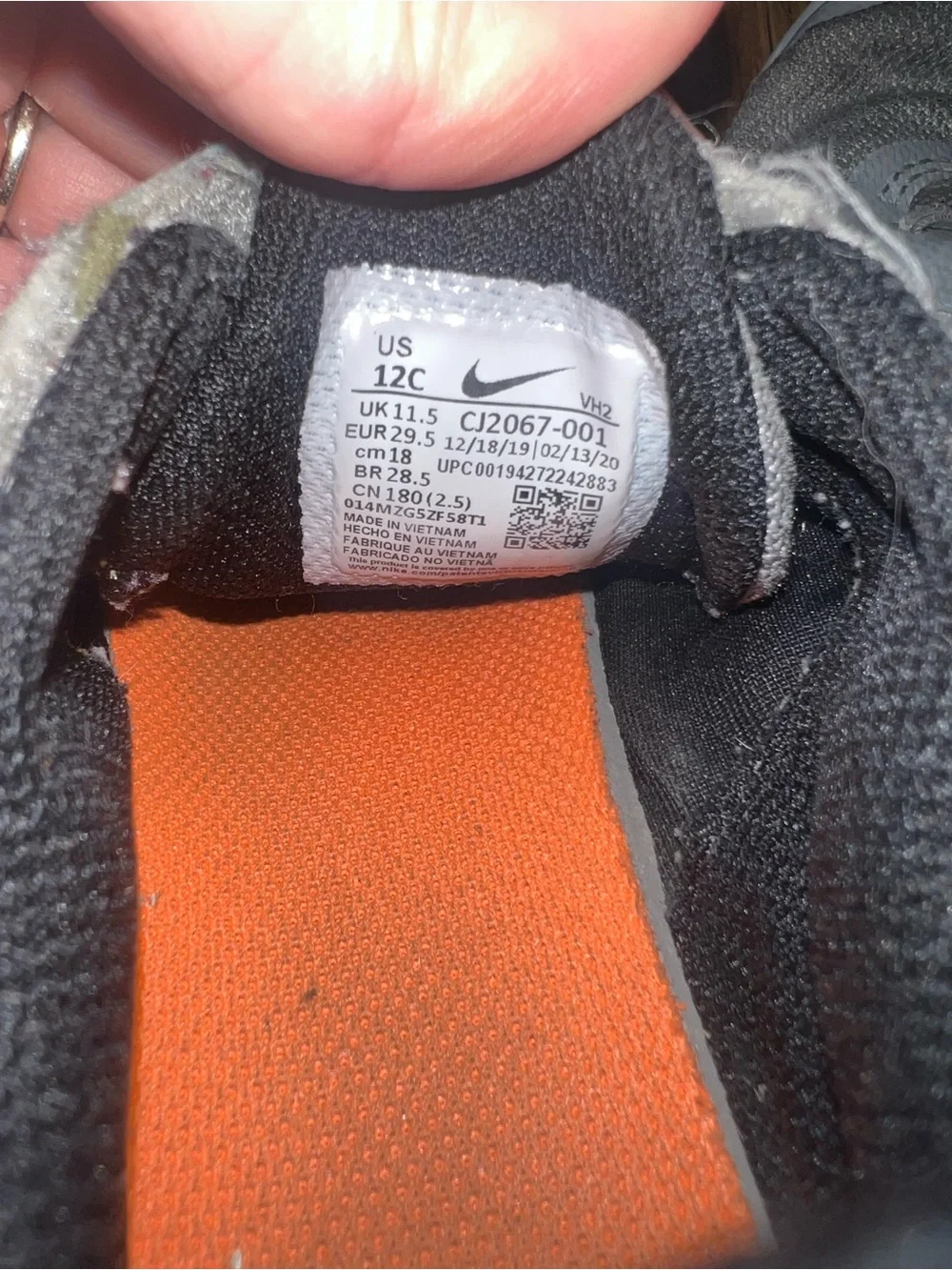Nike Kids Light Gray and Black Sneakers with Orange Accents